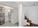 Basement featuring a water heater, utility connections, and access to stairs at 881 Mclinden Se Ave, Smyrna, GA 30080