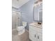 Bathroom featuring a stand-up shower, toilet and vanity with sink at 881 Mclinden Se Ave, Smyrna, GA 30080