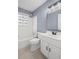 Bathroom features a bathtub, toilet, vanity, and a stained glass window at 881 Mclinden Se Ave, Smyrna, GA 30080
