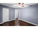 Cozy bedroom features hardwood floors and neutral wall color at 881 Mclinden Se Ave, Smyrna, GA 30080
