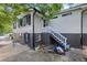 Exterior view of the house showing the entrance stairs and the surrounding grounds at 881 Mclinden Se Ave, Smyrna, GA 30080