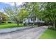 This home has an expansive driveway, a landscaped yard, and a beautiful exterior at 881 Mclinden Se Ave, Smyrna, GA 30080