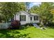 Lovely one-story home with a bright green lawn, tidy landscaping, and cheerful white picket fence at 881 Mclinden Se Ave, Smyrna, GA 30080