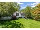 Charming home features a well-manicured lawn and inviting curb appeal with fresh landscaping at 881 Mclinden Se Ave, Smyrna, GA 30080