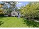 Charming home features a well-manicured lawn and inviting curb appeal with fresh landscaping at 881 Mclinden Se Ave, Smyrna, GA 30080