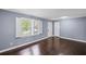Inviting living room boasts gleaming hardwood floors and shuttered windows offering great light at 881 Mclinden Se Ave, Smyrna, GA 30080