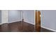Inviting living room boasts gleaming hardwood floors and shuttered windows at 881 Mclinden Se Ave, Smyrna, GA 30080
