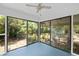 Sunroom featuring large sliding glass doors and a ceiling fan, offering bright interior space at 881 Mclinden Se Ave, Smyrna, GA 30080