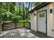 Cozy back porch with black-stained wood and beautiful landscaping at 3176 Pollard St, Atlanta, GA 30344