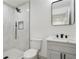 The bathroom has a tiled shower, a gray vanity, and modern fixtures at 3176 Pollard St, Atlanta, GA 30344