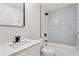 Bathroom features modern black fixtures, herringbone tile and a shower and tub at 3176 Pollard St, Atlanta, GA 30344