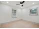 Bedroom with a ceiling fan, two windows, and hardwood floors offers ample natural light at 3176 Pollard St, Atlanta, GA 30344