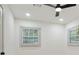 Bright bedroom with neutral paint, ceiling fan, and windows with blinds at 3176 Pollard St, Atlanta, GA 30344