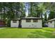 Charming single-story home featuring a freshly painted exterior and a well-manicured front yard at 3176 Pollard St, Atlanta, GA 30344
