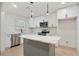 Modern kitchen with an island, stainless steel appliances, and ample cabinet space at 3176 Pollard St, Atlanta, GA 30344