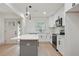Bright kitchen features white cabinets, stainless steel appliances, a gray island, and sleek, modern finishes at 3176 Pollard St, Atlanta, GA 30344