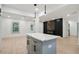 The modern living space includes a kitchen island and a decorative fireplace wall feature at 3176 Pollard St, Atlanta, GA 30344