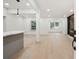 Spacious living area featuring wood floors, pot lights, and a fireplace at 3176 Pollard St, Atlanta, GA 30344
