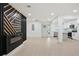 Open-concept area blends living room, kitchen, and dining with a modern fireplace and pot lights at 3176 Pollard St, Atlanta, GA 30344