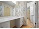 Bathroom with floral wallpaper, large mirror and vanity, and view to a shower at 3595 Limberlost Sw Trl, Stockbridge, GA 30281