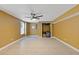 Finished basement featuring tile floors, a ceiling fan, and a closet for storage at 4474 Michael Jay St, Snellville, GA 30039