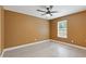 Basement featuring tile flooring, a ceiling fan, and a window at 4474 Michael Jay St, Snellville, GA 30039