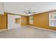 Basement featuring tile flooring, tan walls, and a ceiling fan at 4474 Michael Jay St, Snellville, GA 30039