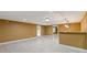 Finished basement featuring tile flooring, a bar, a walkout door, and recessed lighting at 4474 Michael Jay St, Snellville, GA 30039