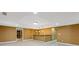 Basement featuring tile flooring, recessed lighting, a bar, and a partial view of rooms beyond at 4474 Michael Jay St, Snellville, GA 30039