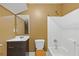 Standard bathroom with a shower/tub combo, single sink vanity, and toilet at 4474 Michael Jay St, Snellville, GA 30039