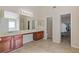 Bathroom featuring dual sinks, vanity, a large mirror, and tile flooring at 4474 Michael Jay St, Snellville, GA 30039