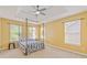 Bedroom featuring a four-poster bed, tray ceiling, and lots of natural light at 4474 Michael Jay St, Snellville, GA 30039