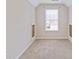 Bedroom featuring plush carpet, a window, and access doors at 4474 Michael Jay St, Snellville, GA 30039
