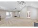 Spacious bonus room with vaulted ceiling, neutral carpet, and multiple windows at 4474 Michael Jay St, Snellville, GA 30039