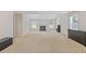 Large bonus room featuring a fireplace, ample natural light, and plush carpeting at 4474 Michael Jay St, Snellville, GA 30039