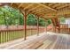 Large wooden deck with railings offers an outdoor living space for relaxing and entertaining at 4474 Michael Jay St, Snellville, GA 30039