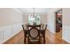 Formal dining room with stylish chandelier and chair rail, perfect for entertaining guests at 4474 Michael Jay St, Snellville, GA 30039