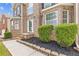 Front entrance featuring brick facade, tidy landscaping, and hardscaped front walkway at 4474 Michael Jay St, Snellville, GA 30039