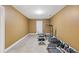 Spacious home exercise room featuring fitness equipment and durable tiled flooring at 4474 Michael Jay St, Snellville, GA 30039