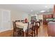 Eat-in kitchen with hardwood floors, island, and stainless steel appliances at 4474 Michael Jay St, Snellville, GA 30039