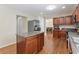 Open kitchen features an island, stainless steel appliances, and hardwood floors at 4474 Michael Jay St, Snellville, GA 30039
