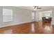 Spacious living room with hardwood floors and ample natural light from large windows at 4474 Michael Jay St, Snellville, GA 30039