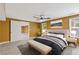 Main bedroom with seating at foot of bed, tiled floors, and lots of light at 4474 Michael Jay St, Snellville, GA 30039