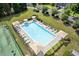 Aerial view of the pristine community pool area, featuring ample lounge chairs and shade umbrellas at 4474 Michael Jay St, Snellville, GA 30039