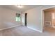 Bedroom with carpeted floors and natural light, featuring a built-in closet for ample storage at 1079 Stonewall Drive Southeast, Atlanta, GA 30315