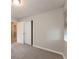 Bright bedroom with light gray carpeting, a window and a closet at 1079 Stonewall Drive Southeast, Atlanta, GA 30315