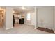 Open-concept living room next to the kitchen with white cabinets and appliances at 1079 Stonewall Drive Southeast, Atlanta, GA 30315