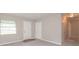 Well-lit living room featuring neutral paint, a window, and a closet at 1079 Stonewall Drive Southeast, Atlanta, GA 30315