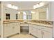 Bathroom vanity featuring double sinks, granite countertops, and ample storage within drawers and cabinets at 121 Fairway Overlook, Woodstock, GA 30188