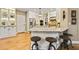 Beautiful open kitchen with counter seating, stainless appliances and custom white cabinets and backsplash at 121 Fairway Overlook, Woodstock, GA 30188